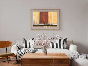 Cracked wood and a chipped stone ledge reveal the texture of a Florence window.