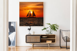 Twin sail charter boat on calm ocean horizon