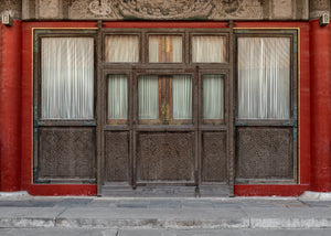 Geometric carvings cover an ornate wooden doorway in Beijing’s Forbidden City