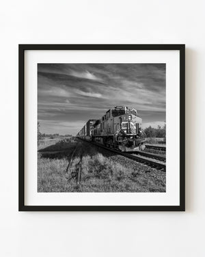 Freight locomotive 2948 approaches along prairie tracks near Hubbard, Saskatchewan, in black and white