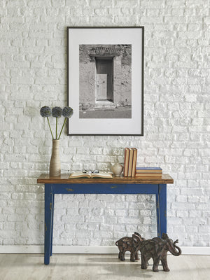Weathered boards and heavy metal latches on a historic Fremantle Prison cell door