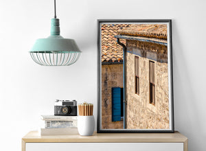 French house windows and weathered roof tiles in warm afternoon light