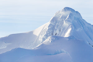 Snow-Covered Antarctic Mountain with Soft Blue Shadows