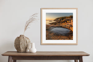 Square Acadia seascape with a frozen puddle, rugged rocks and a calm ocean horizon