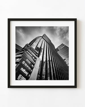 Garak Tower East rises above street signs in a black and white upward view of Seoul architecture