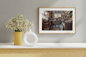 Old televisions and display cabinets surround Route 66 souvenirs at Gay Parita
