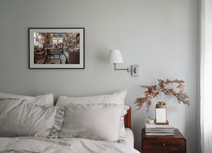 Sinclair signs, model cars and framed photographs create a dense Route 66 interior scene
