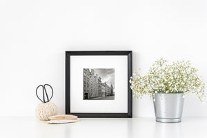 Rows of white-framed windows repeat across historic gabled buildings in Gdańsk