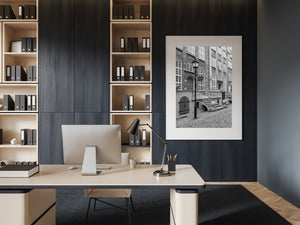 Repeated window panes and a traditional streetlamp define a quiet Polish streetscape