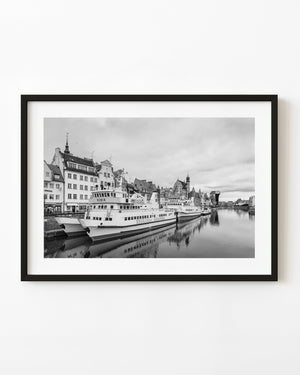 Tour boats Rubin and Onyx are docked along Gdańsk’s historic waterfront in black and white