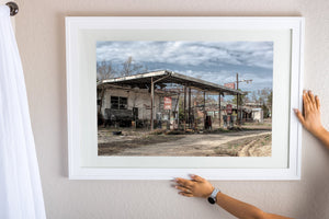 Colour roadside photograph of an empty Georgia gas station with exposed roof beams