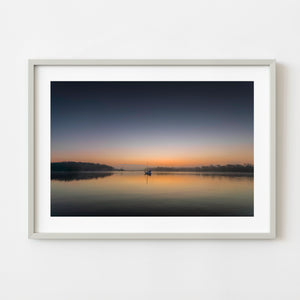 Anchored sailboat at sunrise on the Georgia ICW