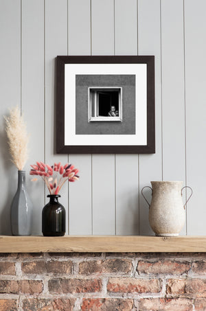 Frankfurt apartment window portrait elderly woman observing street scene