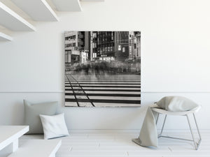 Modern interior with a large black and white cityscape painting on the wall.