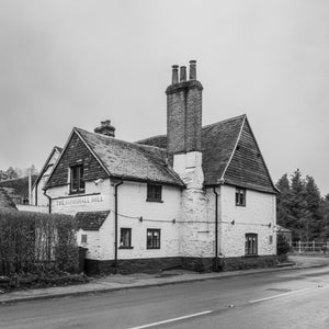 Whitewashed walls and steep tiled roofs define the historic Gomshall Mill building