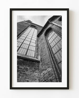 Tall Gothic windows rise above weathered brickwork at St Mary’s Basilica in Gdansk