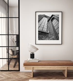 Weathered masonry and towering windows fill a dramatic monochrome basilica view