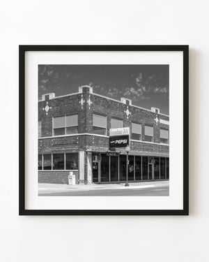 Grandma Jo’s brick corner building in Sidney, Nebraska, photographed in black and white