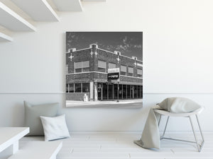 Large upper windows line the brick façade of Grandma Jo’s in Sidney