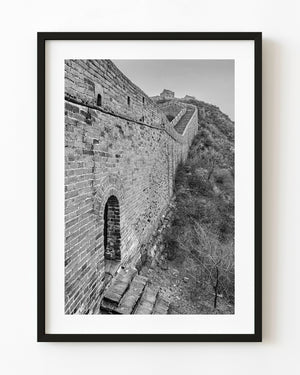 An arched doorway and steep staircase trace the Great Wall’s brickwork in black and white