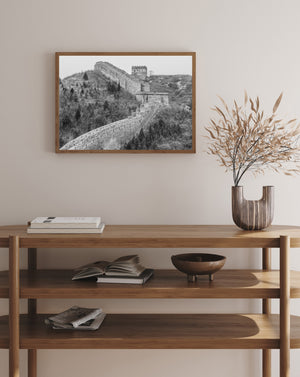 Repeating battlements and bare hillside textures form a monochrome Great Wall landscape