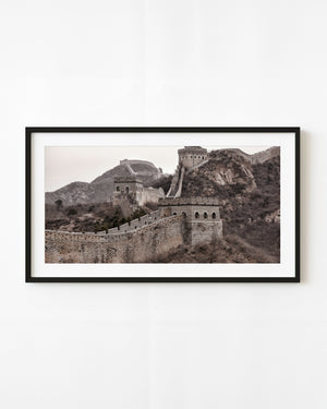 Great Wall watchtowers and steep stairways cross rugged mountain ridges