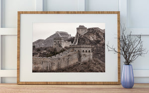 Arched watchtower windows punctuate the Great Wall’s textured brickwork
