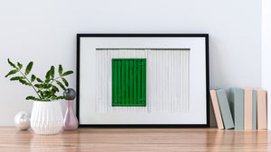 Dark gaps between green planks contrast with evenly spaced white wall boards
