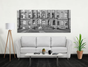 Tall classical columns frame reflective windows on a Nova Scotia building