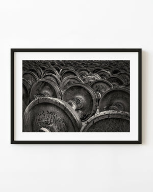 monochrome rail car wheels stacked in industrial yard Hamilton Ontario