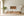 Warm toned photograph of tobacco leaves drying in Cuban barn