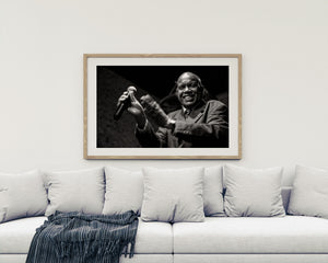 Cuban jazz performer singing with microphone in nightclub