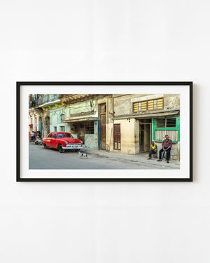 Classic red car parked on a Havana street