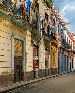 Hanging laundry on wrought iron balconies in Havana