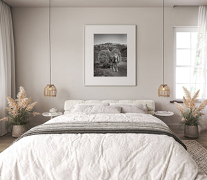 Young farmer driving hay wagon countryside