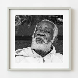 Black and white portrait of elderly man with white beard