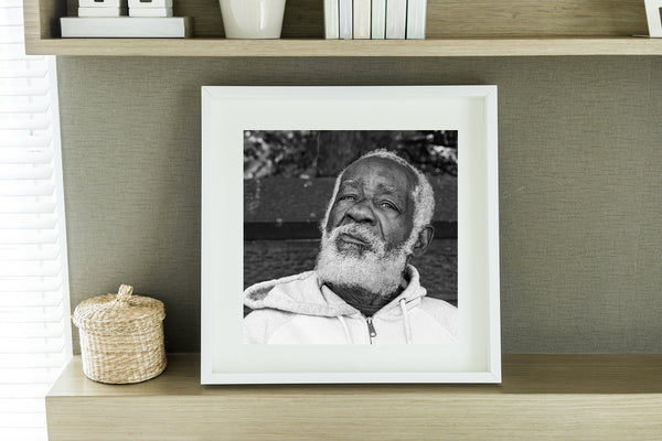 Elderly man with white beard in black and white