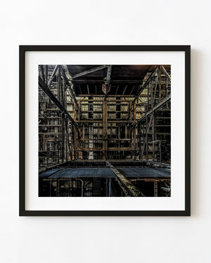 Steel beams, platforms and pipes fill the dark interior of Toronto’s Hearn Generating Station.