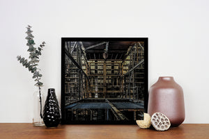 Dark steel structure and overhead beams create geometric patterns inside Hearn Generating Station.