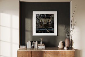 Shadowed platforms and steel crossbeams inside Toronto’s Hearn Generating Station form a dense industrial scene.