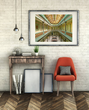 Havana architectural interior with layered balconies and an arched stained-glass ceiling at Hotel Raquel.