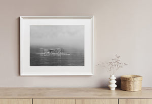 Whale tail silhouette in calm water