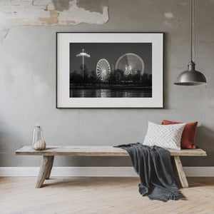 Night scene of London fairground with light trails