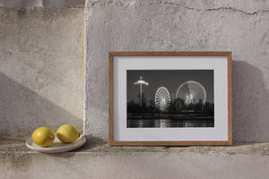 Urban winter landscape with illuminated spinning rides