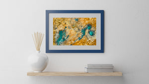 Abstract patterns of turquoise pools, ochre earth and white mineral patches viewed from above.