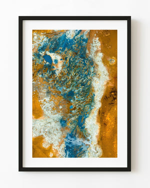 Blue geothermal pools and channels surrounded by gold and white mineral patterns in an Icelandic aerial landscape.