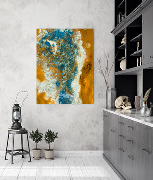 Turquoise and deep blue geothermal formations contrast with white deposits and orange earth in Iceland.