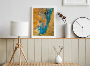 Turquoise and pale blue mineral patterns contrast with orange earth in Iceland.