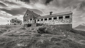 coastal Iceland ruins old structures with graffiti black and white