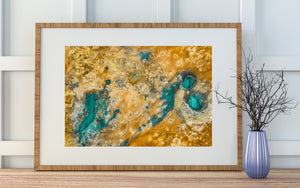 Drone view of geothermal mineral patterns and pools in Iceland landscape